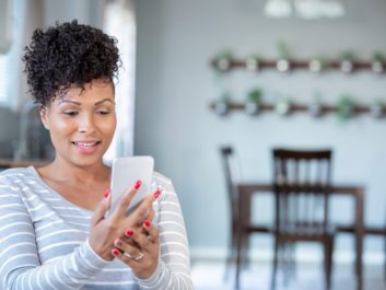Mature woman uses smart phone for telemedicine appointment with doctor